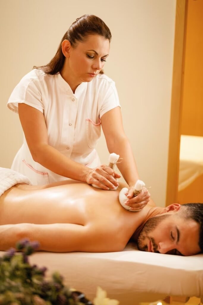 female-massaging-back-man